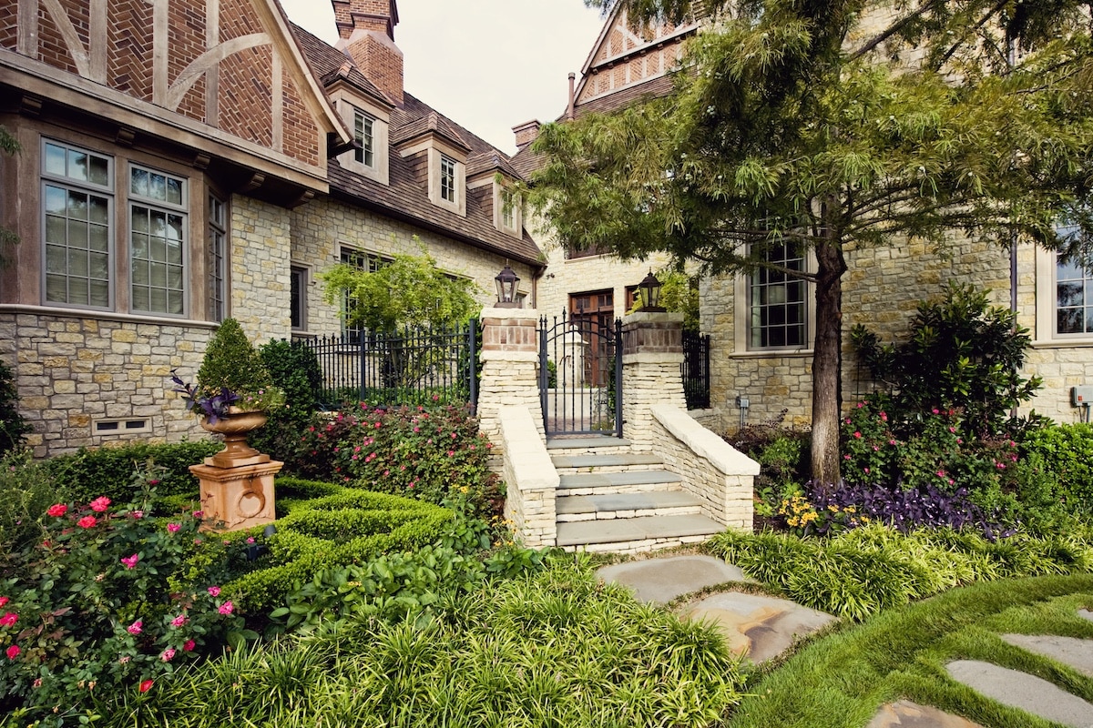 classic garden and front door of classic english manor estate